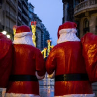 A bustling city in christmas with santas